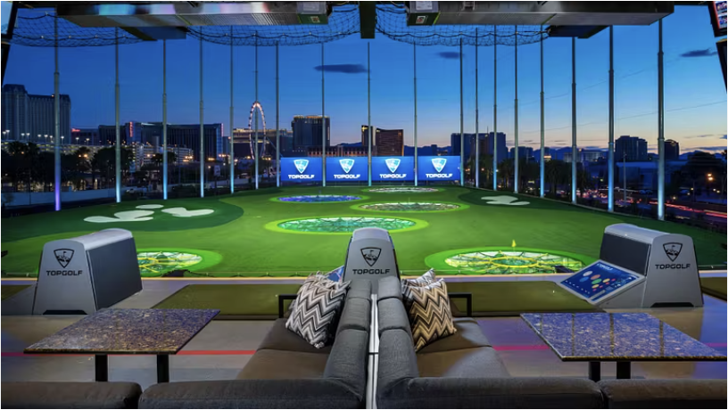 Lounge seating overlooking the Topgolf bays and skyline